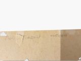 a picture of a piece of cardboard with writing on it