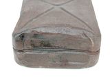 a small metal box with a lid on a white surface