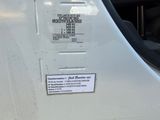 a picture of a white van with a sticker on it