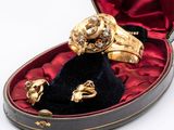 a box with a ring and two other items in it