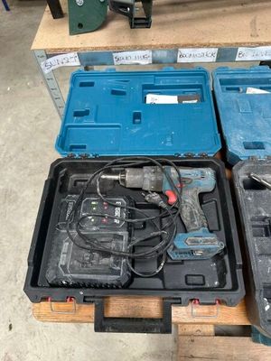 two tools sitting in a case on a pallet