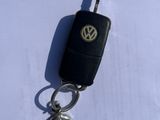 a car key that is laying on top of a piece of paper