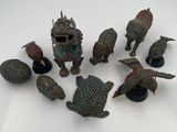 a lot of figurines that are sitting on a table