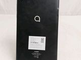 the back of a black tablet computer sitting on top of a white surface