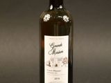 a bottle of wine that is sitting on a table