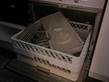 a dishwasher that has a bunch of dirty dishes inside of it