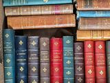 a box full of old books sitting on a table