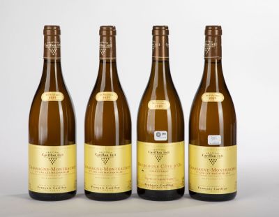 trois bouteilles de vin posées l'une à côté de l'autre sur une table