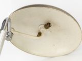 a close up of a lamp on a white surface
