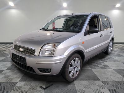a picture of a silver car parked in a garage
