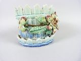 a blue and white vase with flowers in it