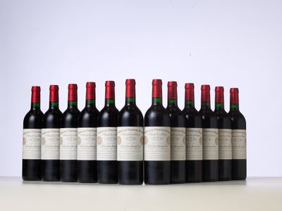 six bottles of red wine lined up in a row