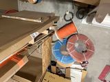 a pile of boxes and a pair of scissors on the floor