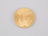 an image of a gold coin sitting on top of a white surface