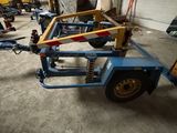 a picture of a small trailer being worked on in a garage