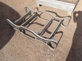 a metal bed frame that has been placed on the ground