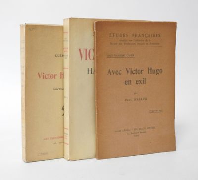 two books sitting on top of each other on a white surface