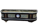 an image of a black and gold planter with a blue seal on it