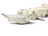 two silver birds sitting on top of each other