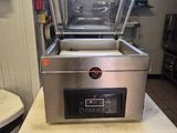 a machine that is sitting on a table in a kitchen