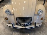 a white car that is parked in a garage