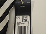 a black and white bag with a price tag attached to it
