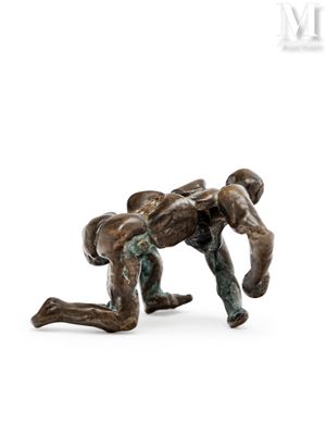 statue of a man wrestling with another man in a wrestling ring