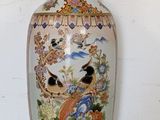 a vase that is sitting on a shelf in a room