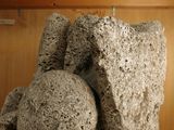 a sculpture of a bear made out of rocks on a table