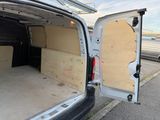 a white van with a door open on the side of the road