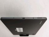 a close up of the back of a black tablet computer