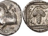 a silver coin with an image of a horse on it