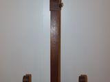 a picture of a wooden easel with a tile top