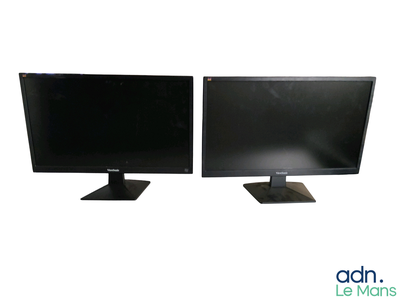 two computer monitors sitting side by side on a white surface