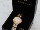 the watch is in a black box on a marble surface