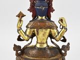 an image of a statue of a person sitting on top of a table