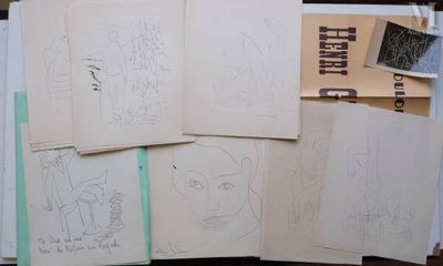 a lot of drawings that are on the table