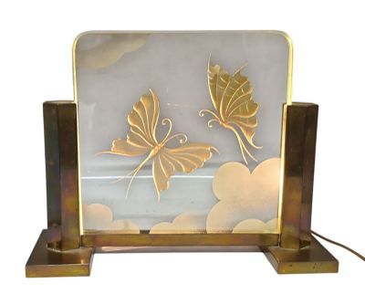 two butterflies on a glass plate with a metal stand