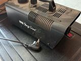 a black blower sitting on top of a black box