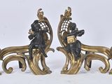 a pair of statues that are sitting on a bench