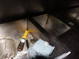 a sink with a lot of dirty items in it