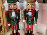 pair of wooden nutcrackers sitting on top of a table