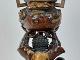 an image of a statue of a woman holding a bowl on her head