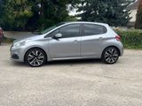 a picture of a silver car parked in a parking lot