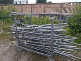 a pile of metal pipes sitting in the middle of a yard