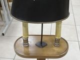 a lamp that is sitting on a stand on the floor