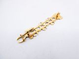 an image of a gold plated metal brooch with a flower design