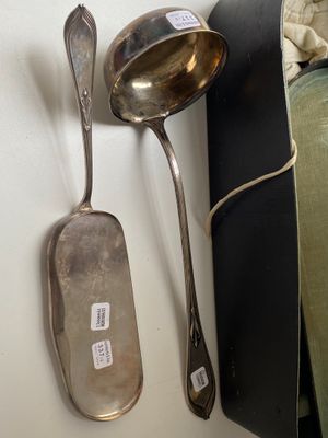 two spoons and a spoon rest on a table
