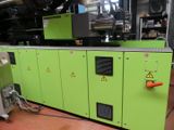 a green machine that is sitting in a room