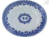 an image of a blue and white plate with a design on it